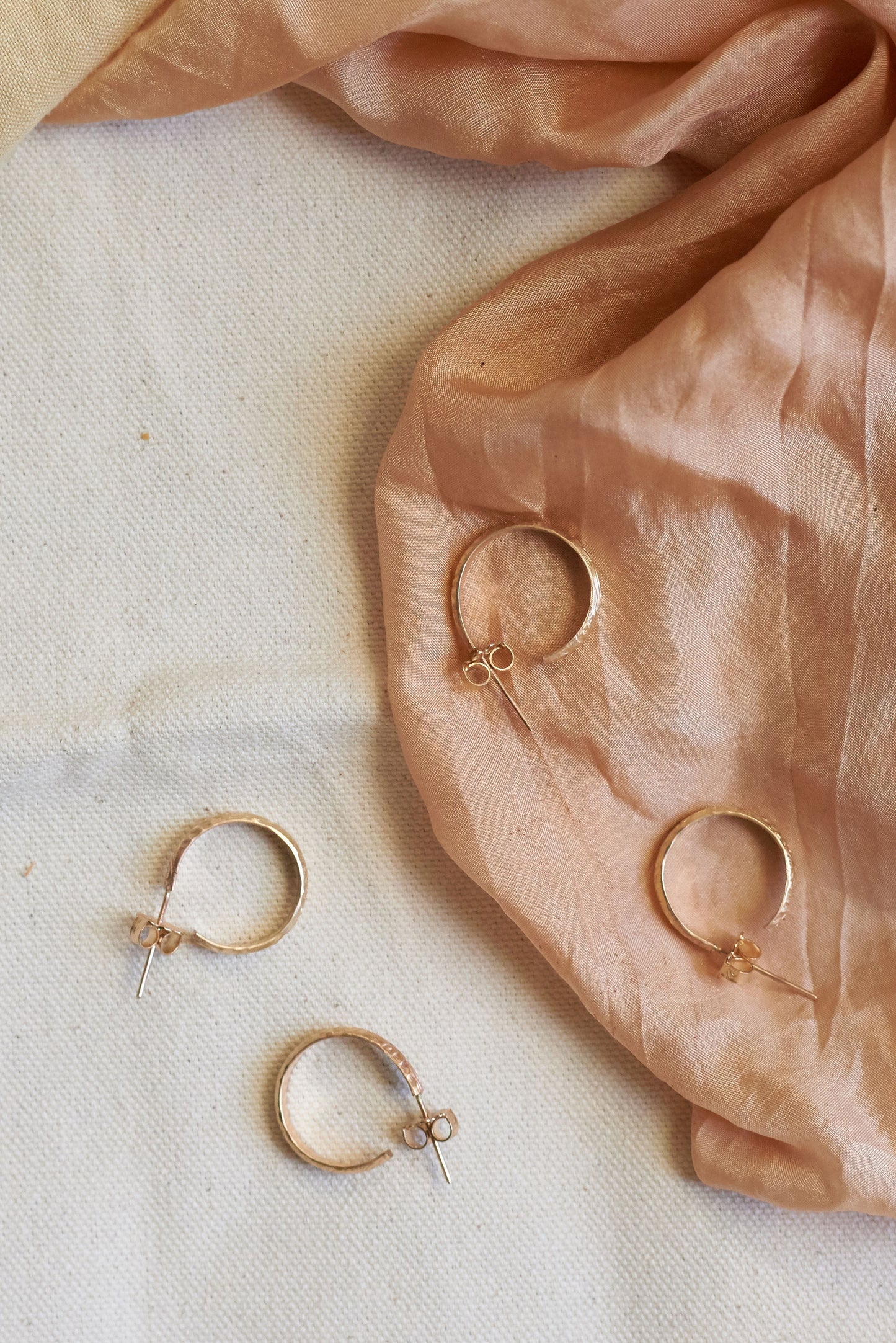 14k Gold Filled hoops with engraved floral details. Photo by Molly Gilholm