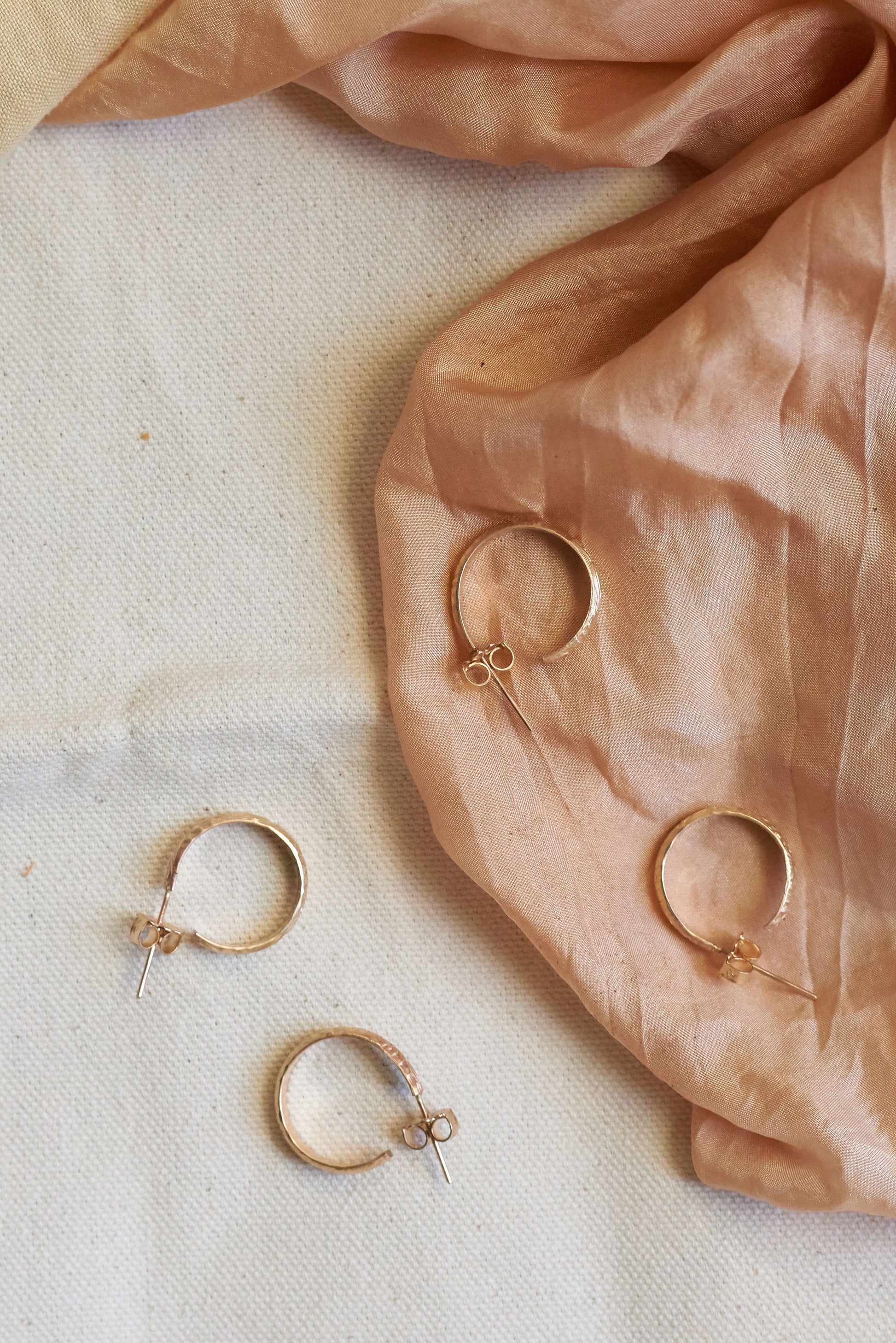 14k Gold Filled hoops with engraved floral details. Photo by Molly Gilholm